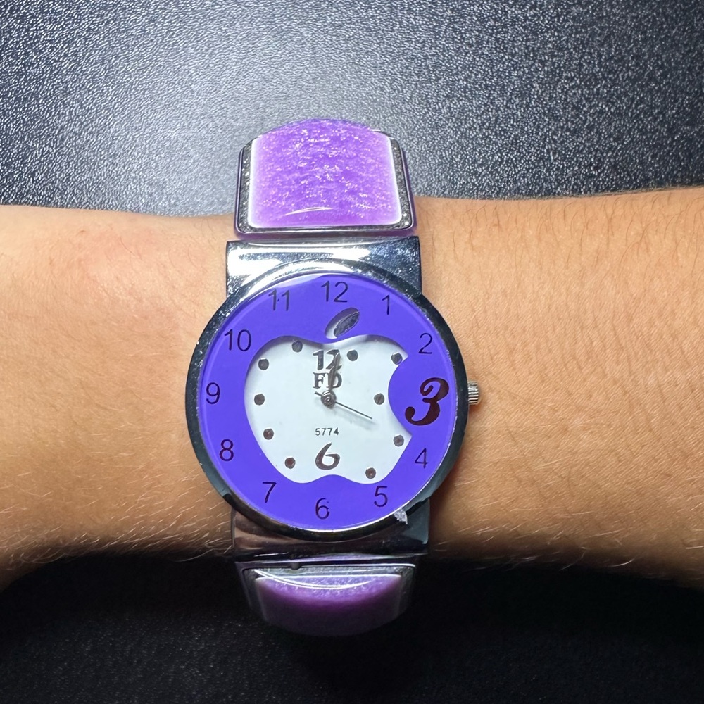 Purple ceramic watch with an Apple logo face